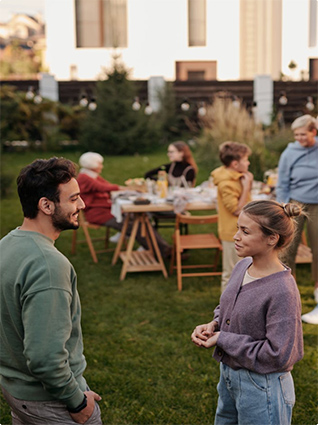 Two people talking at outdoor event