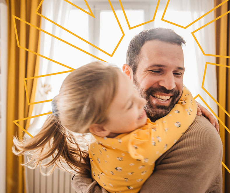 Father and daughter playing in living room