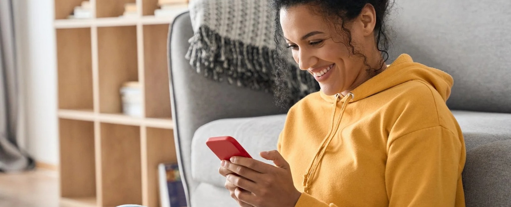 a woman looking at her mobile device.