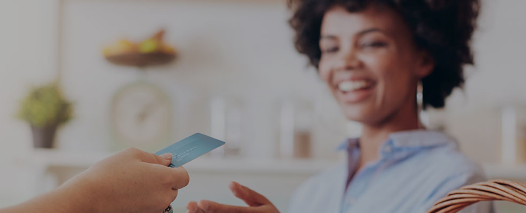 a person making a credit/debit card purchase