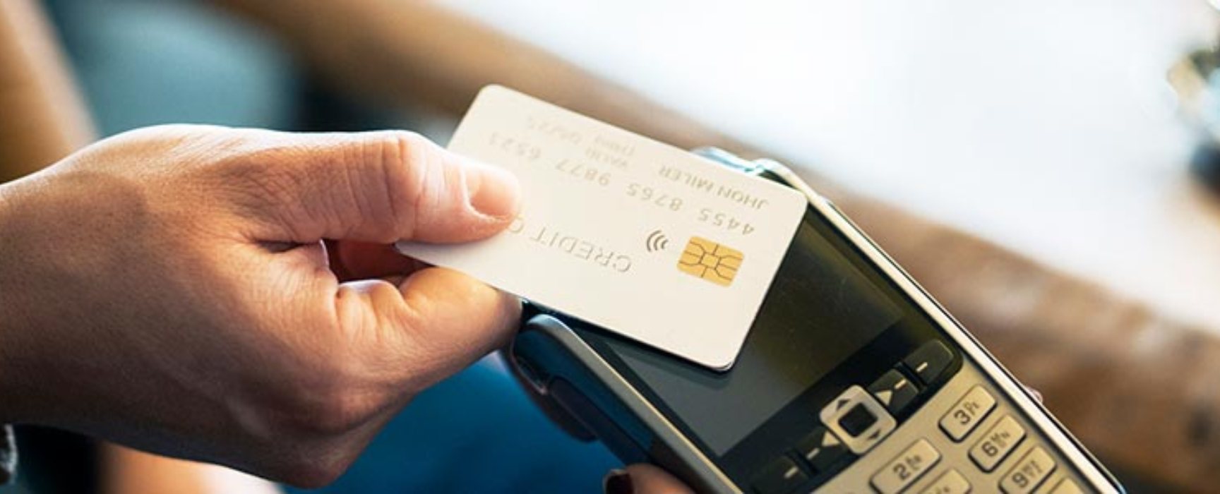 a person paying with a debit/credit card