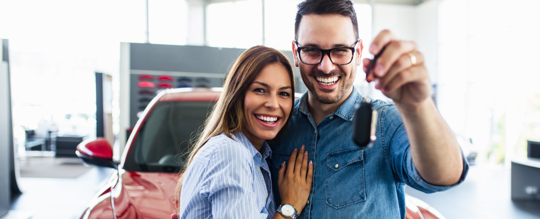a couple with a new car